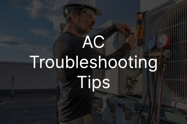 An HVAC technician working on an outdoor AC unit with the words, "AC troubleshooting tips."